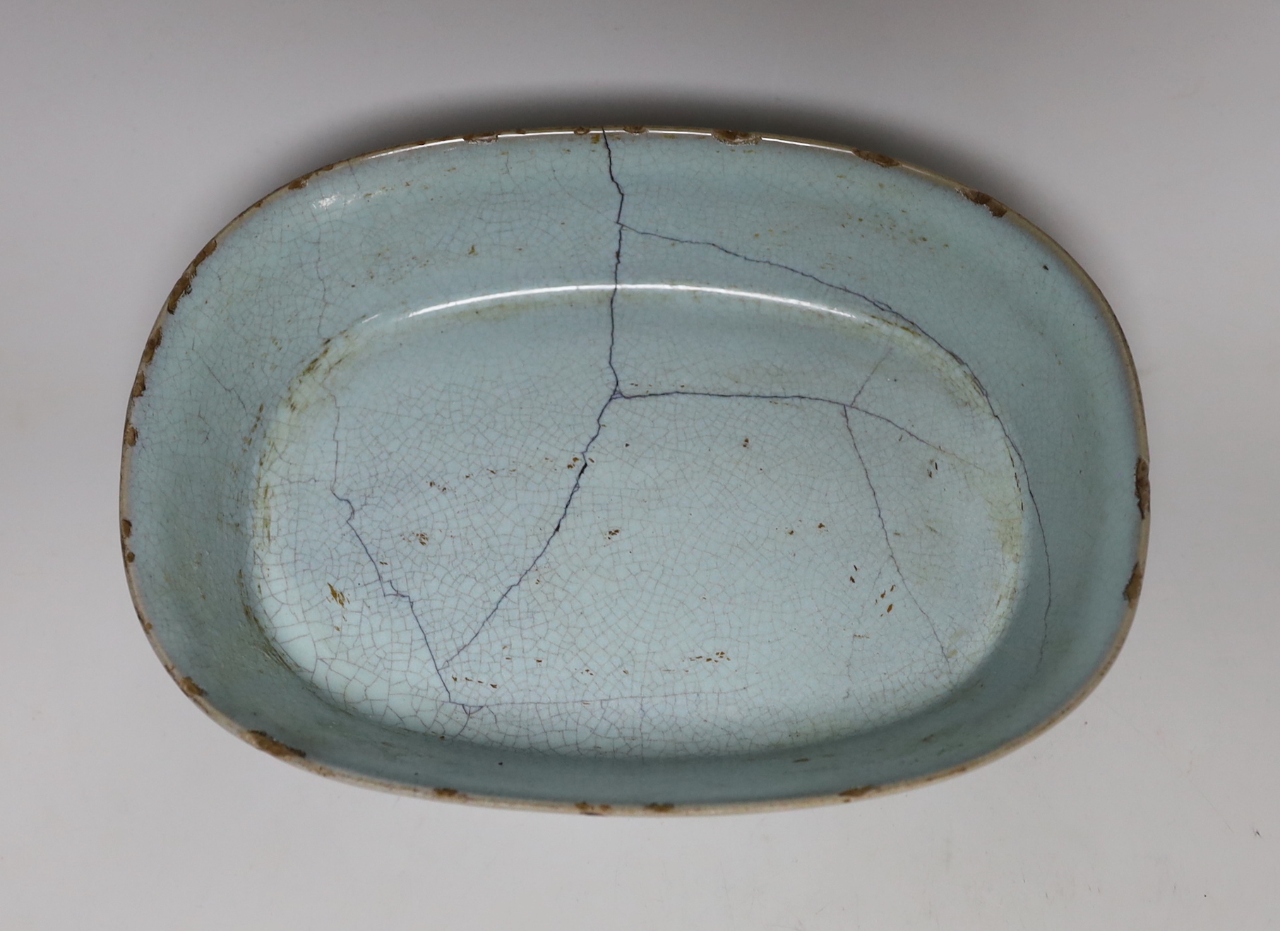 A Chinese celadon crackle glazed oval dish, 23cm wide